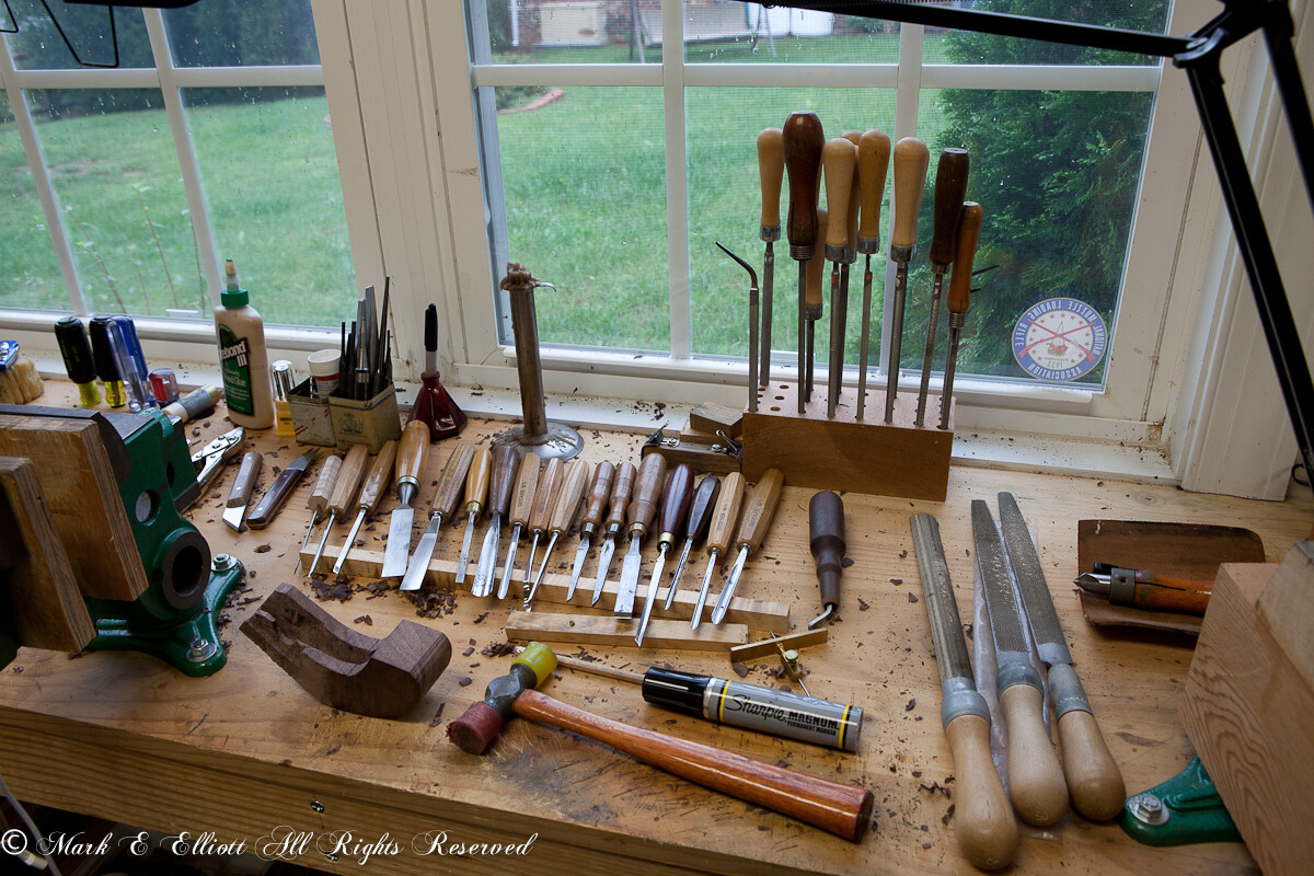Workbench with tools; files, chisels, gouges, hammer, scrapers, etc...