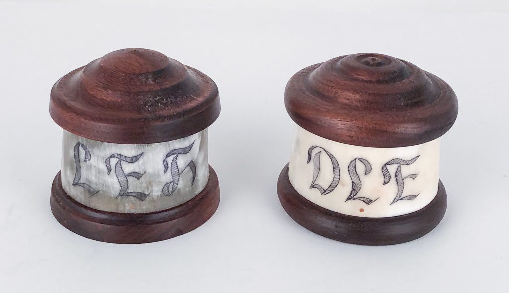 Small engraved horn containers with Walnut tops and bottoms.